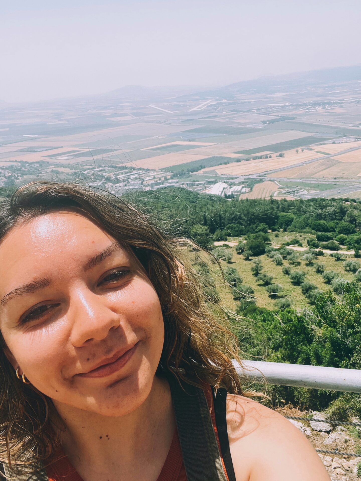 Girl standing in front of view from Mount Carmel.